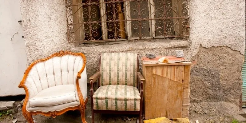Old furniture set aside for disposal or junk removal