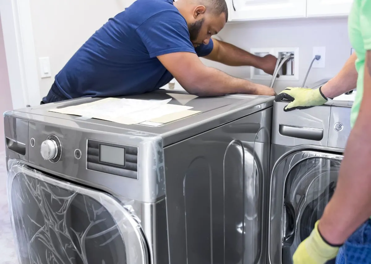 Washer and dryer being disconnected and prepared for moving