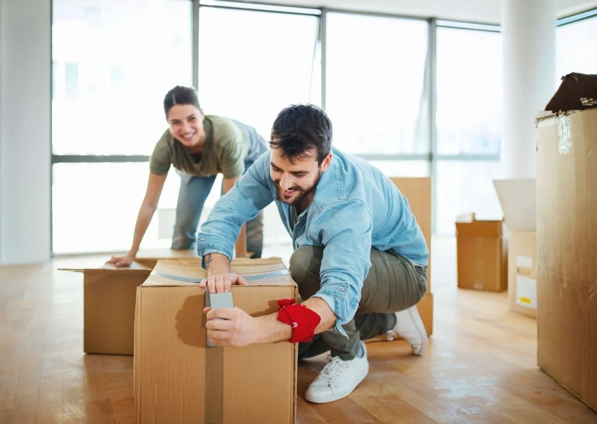 Labeled moving boxes stacked and organized for an out-of-state move