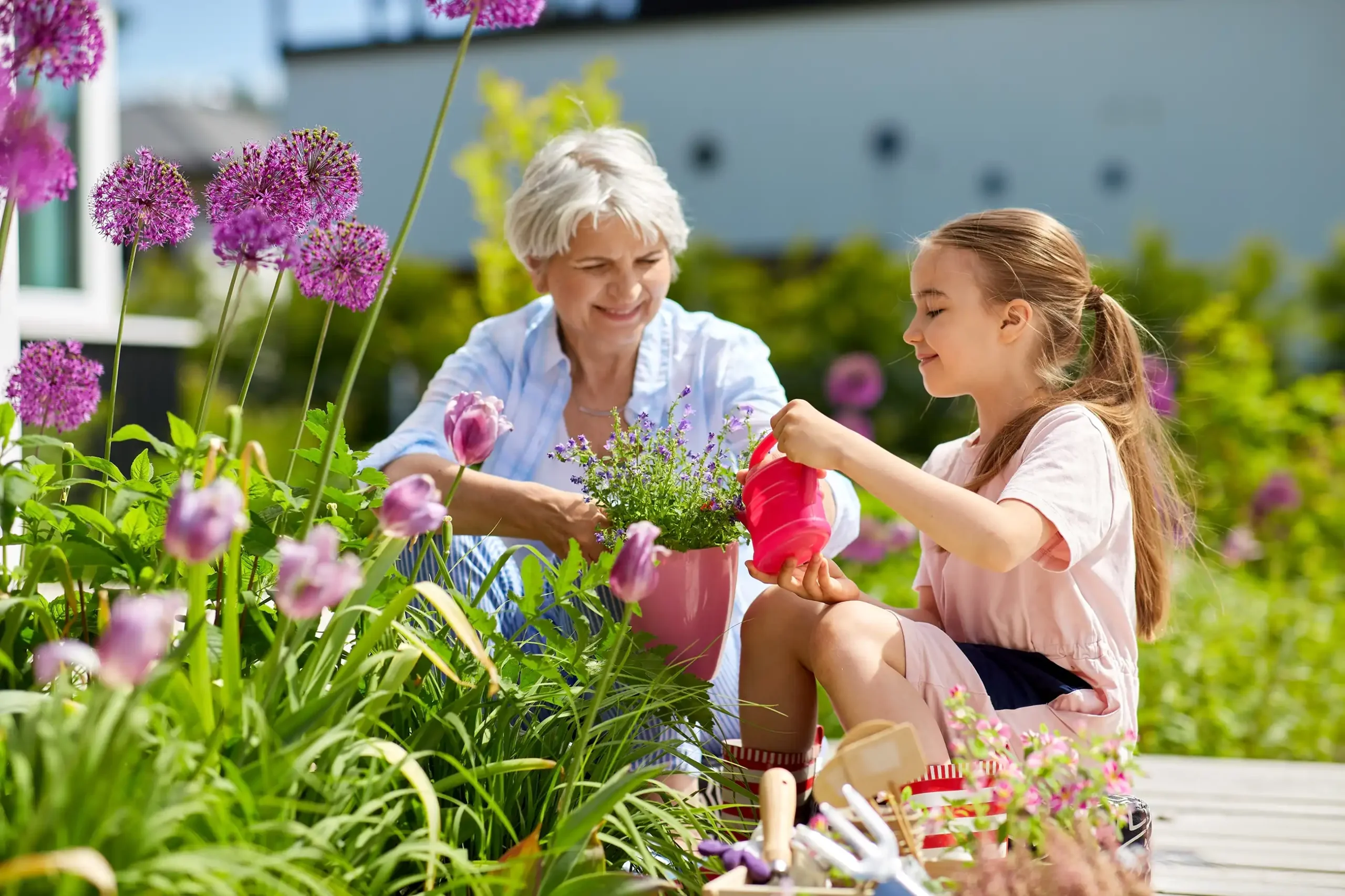 Woman gardening with her grand daughter