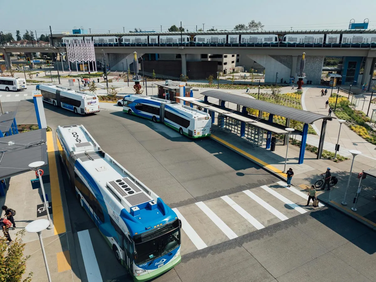 Buses and a Link light rail train at Lynnwood City Center Station, connecting local transit riders in Snohomish County.
