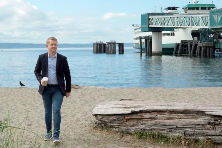 Ken Jennings walking on the beach.