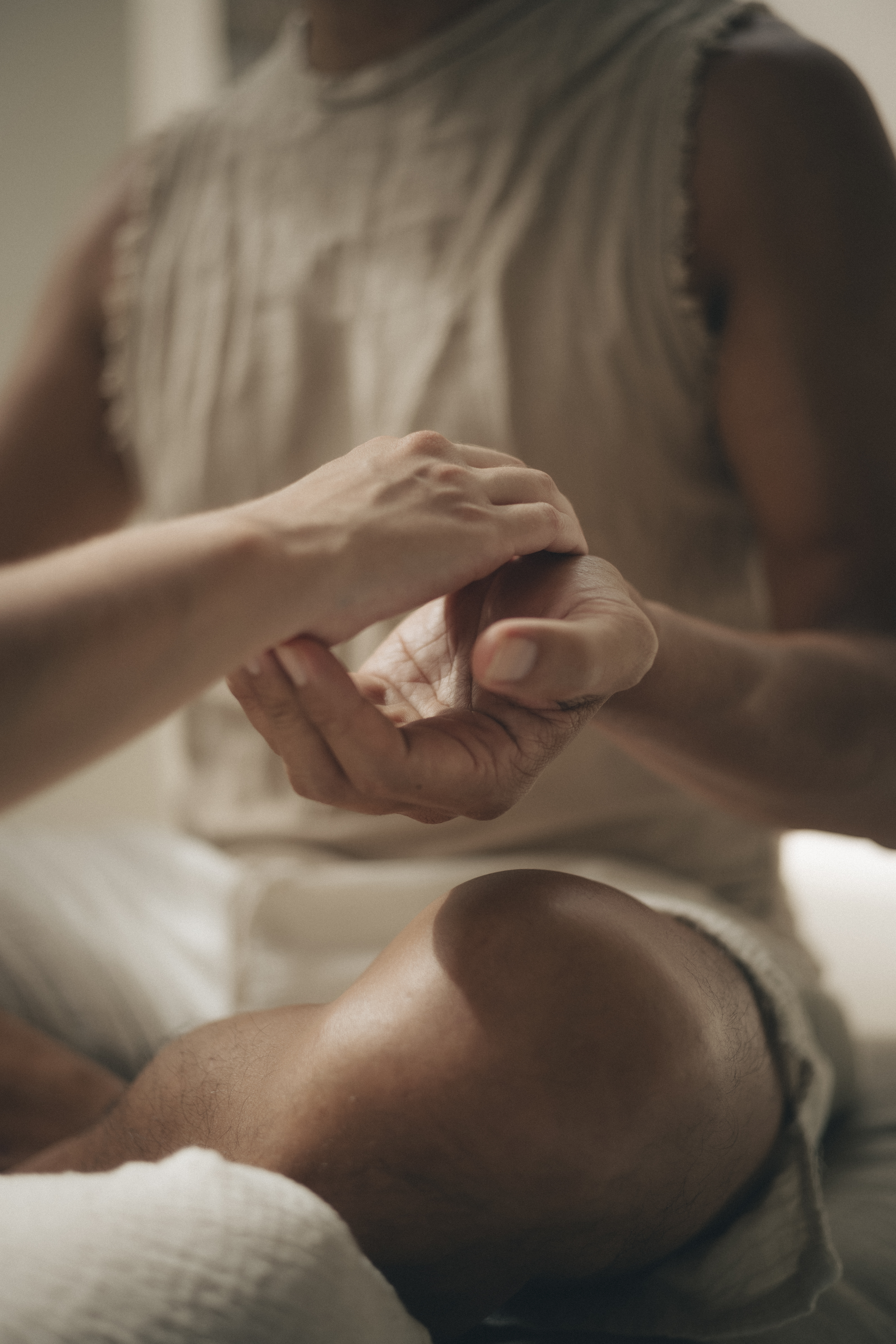Hands meeting gently during an embodied practice