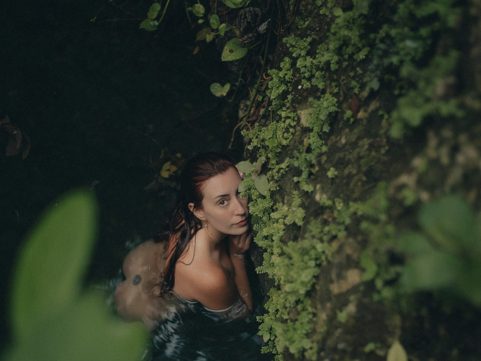 Delfina surrounded by green vegetation