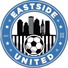 Eastside United soccer team logo with city skyline and soccer ball inside a blue circular border marked EST 2020.