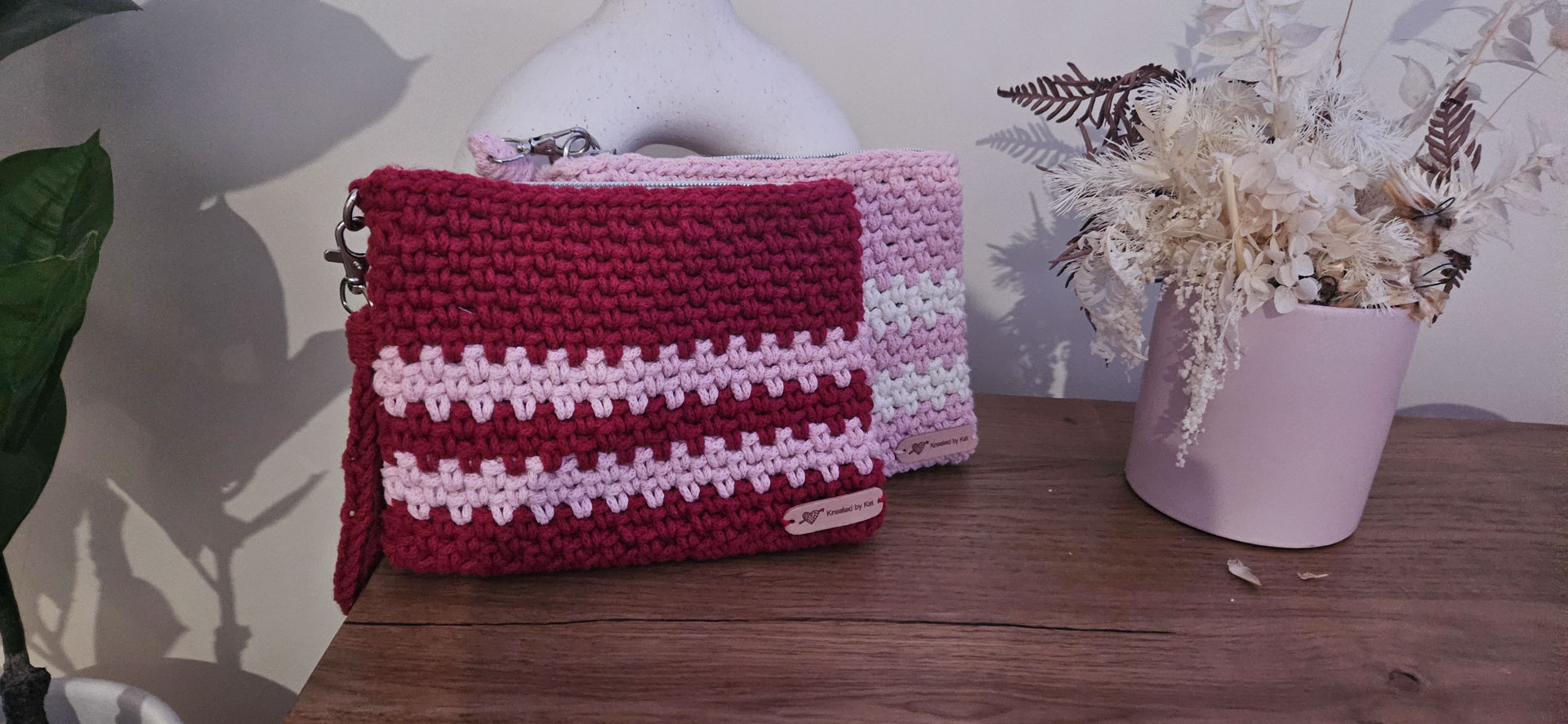 Two pink and red and white clutches in Rockhampton.