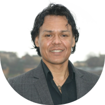 Portrait photo, man smiling in blazer (circular)