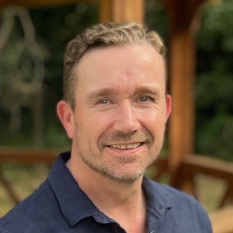 A headshot of James Barton