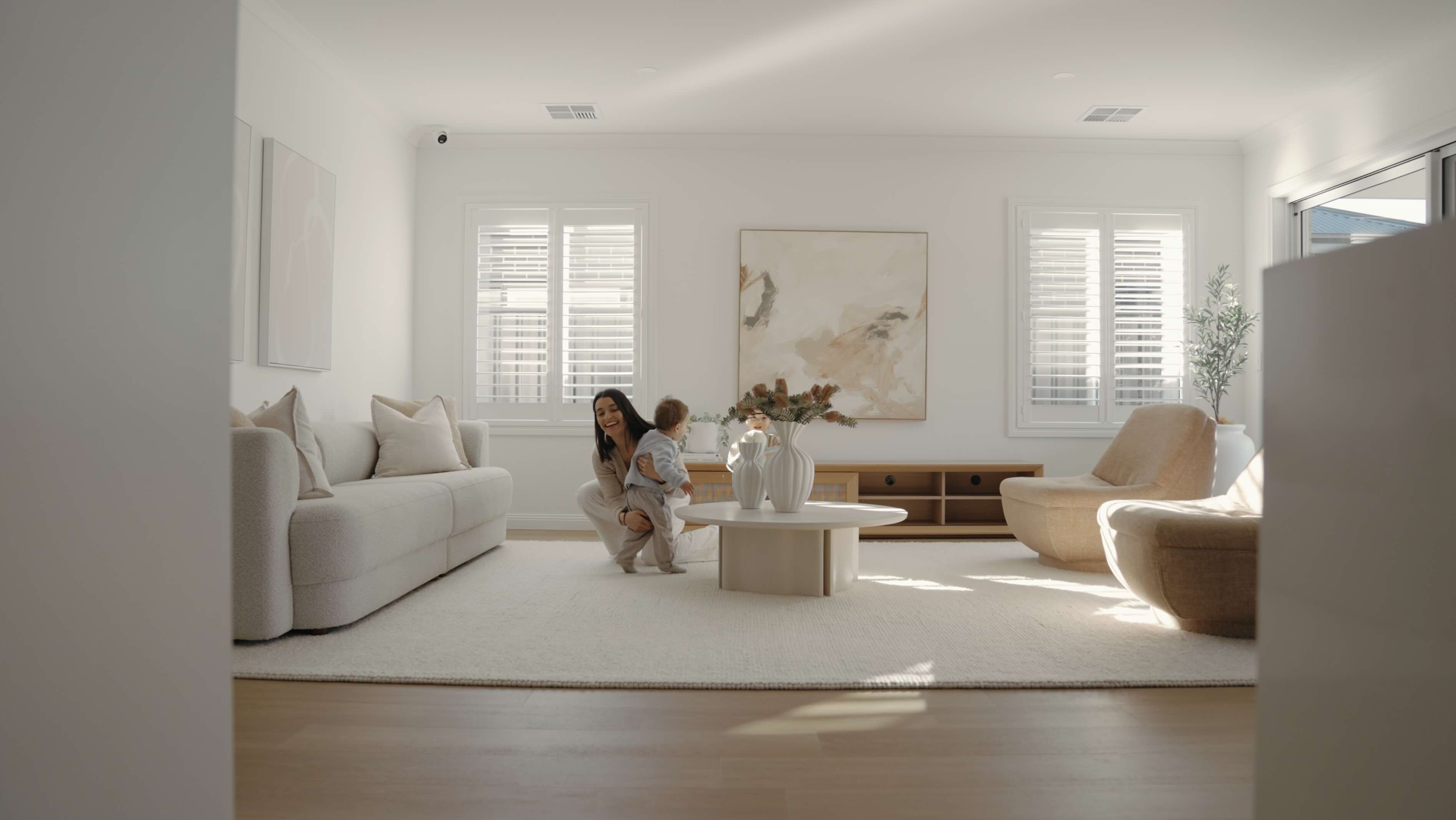 a bright loungeroom with a mother and son