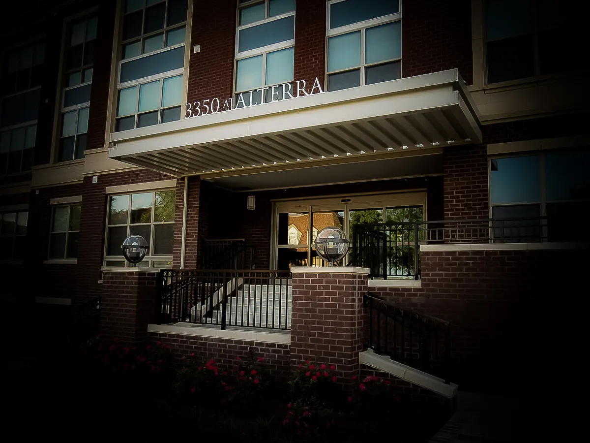 Commercial exterior of 3350 Alterra building with signs, awnings, and shades