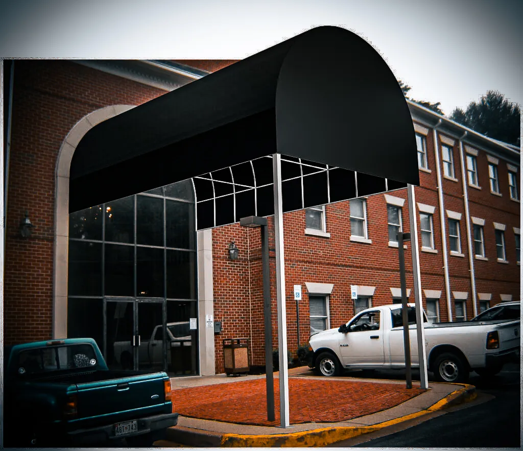 Commercial exterior with glass entrance, black awnings, and parking shades