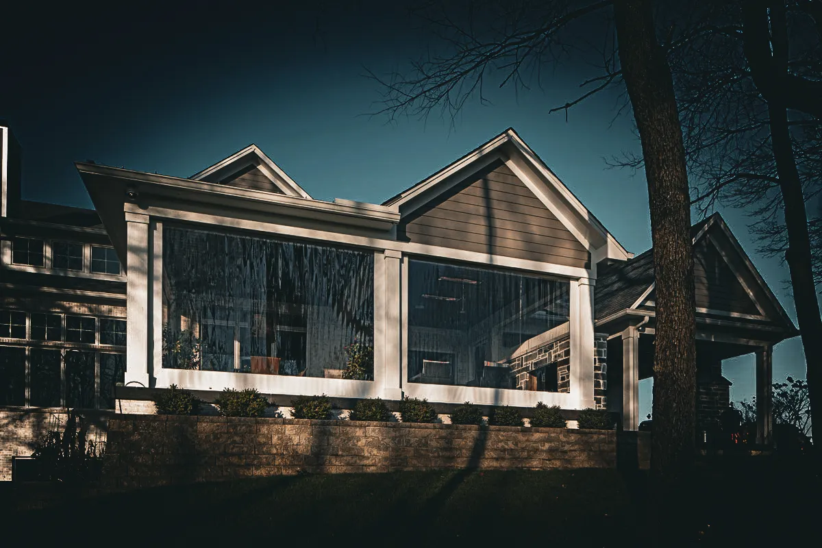 Commercial exterior with glass shades, signs, and awnings at dusk