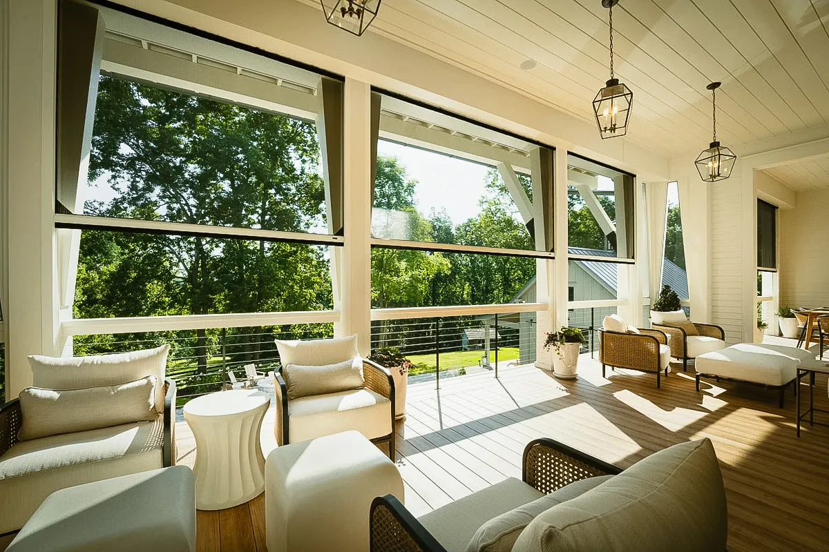 Commercial interior and exterior space with large windows, shades, and awnings