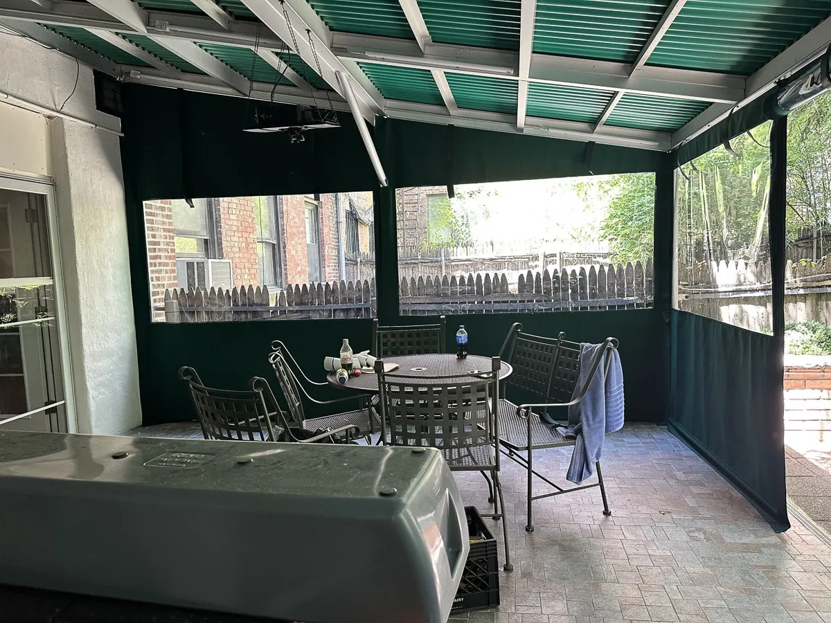 Commercial interior and exterior space with shades, awnings, and signs