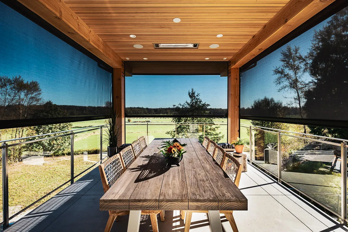 Commercial exterior and interior space with shades, awnings, and dining signs