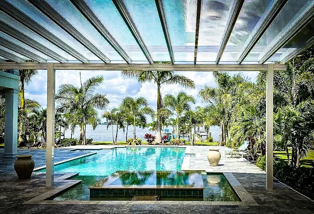 Commercial Exterior with Glass Shades, Poolside Awnings, and Tropical Landscape