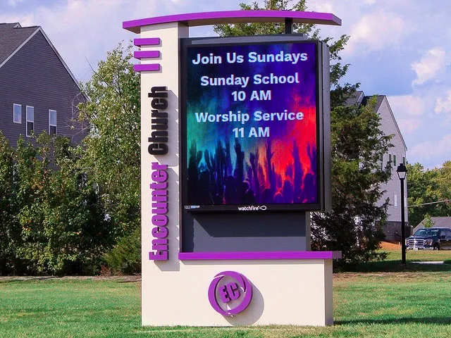 Commercial exterior church sign with colorful digital display advertising Sunday services