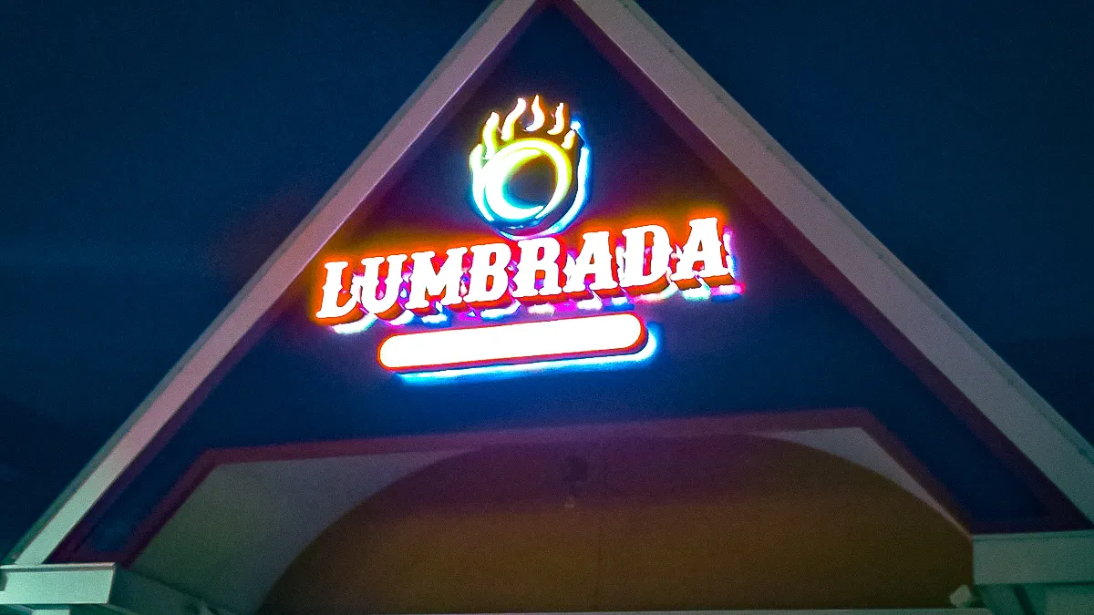 Commercial Exterior Sign: Illuminated Lumbrada Logo with Glowing Fire Emblem