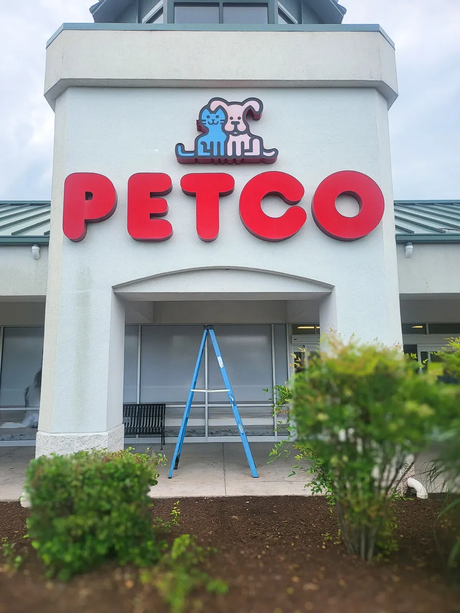 Commercial Petco exterior with large signs, awnings, and exterior shades