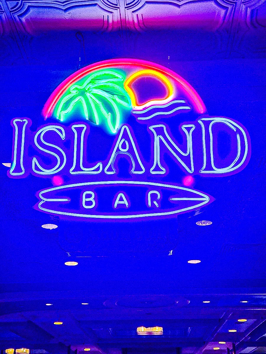 Commercial neon sign for Island Bar with exterior tropical palm design