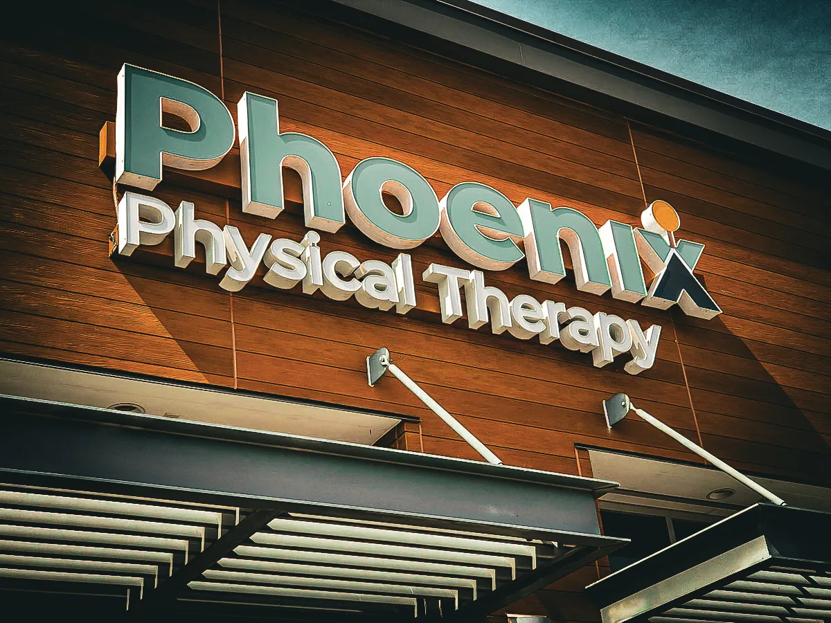 Commercial exterior with Phoenix Physical Therapy signs, awnings, and shades