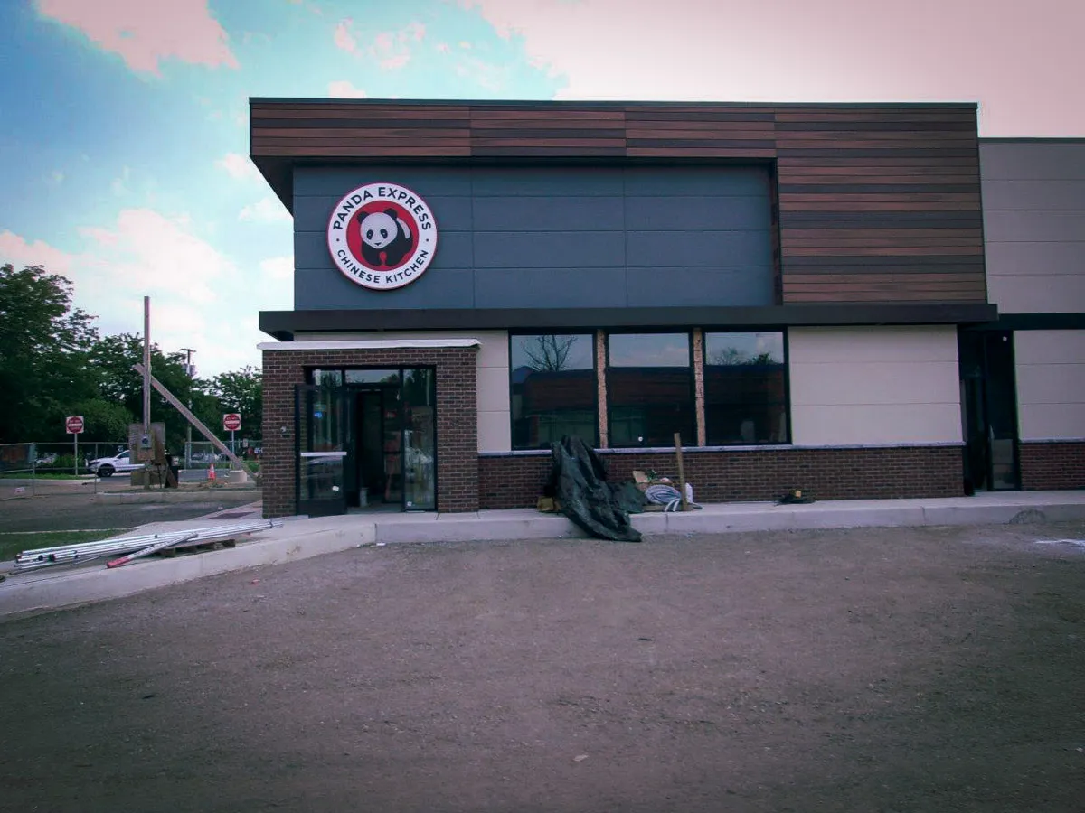 Commercial exterior of Panda Express with signs, awnings, and shades