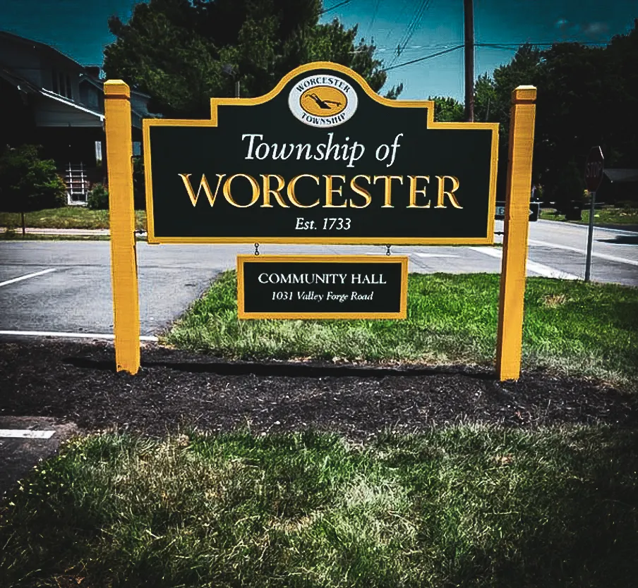 Commercial exterior sign for Worcester Township Community Hall with yellow framing