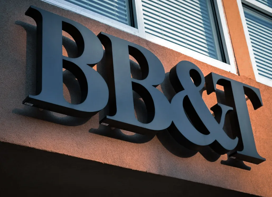 Commercial exterior sign with BB&T logo on building with window shades