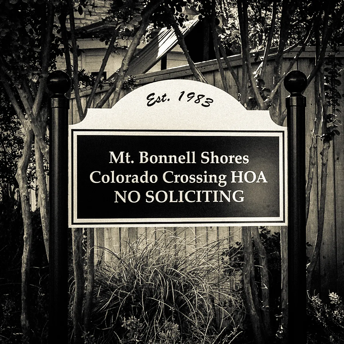 Commercial exterior sign for Mt. Bonnell Shores HOA with awning and shades
