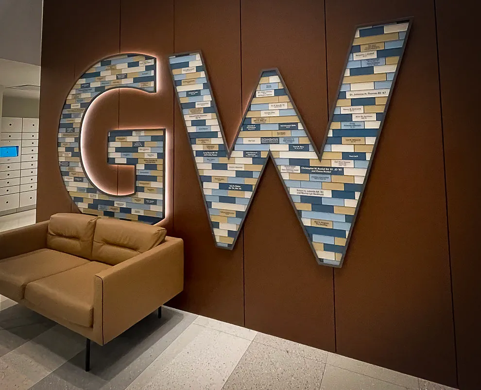Commercial interior with GW signs, leather sofa, and decorative wall shades