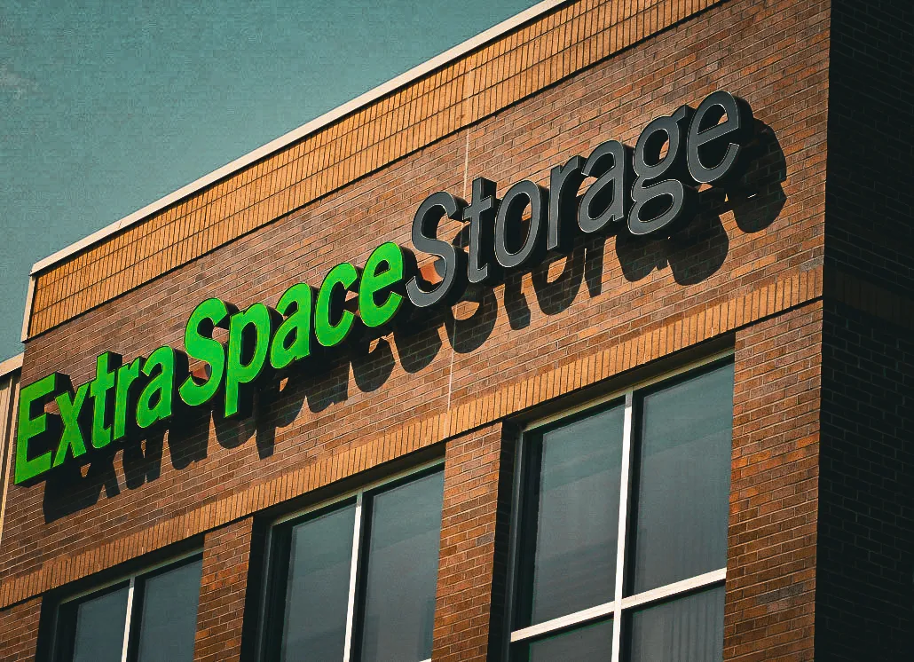 Martino Signs designs ExtraSpace Storage logo on brick building exterior