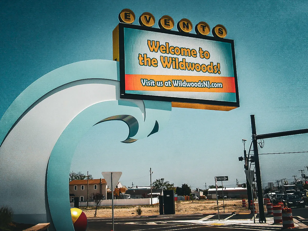Commercial exterior sign welcomes visitors to Wildwoods with curved architectural element