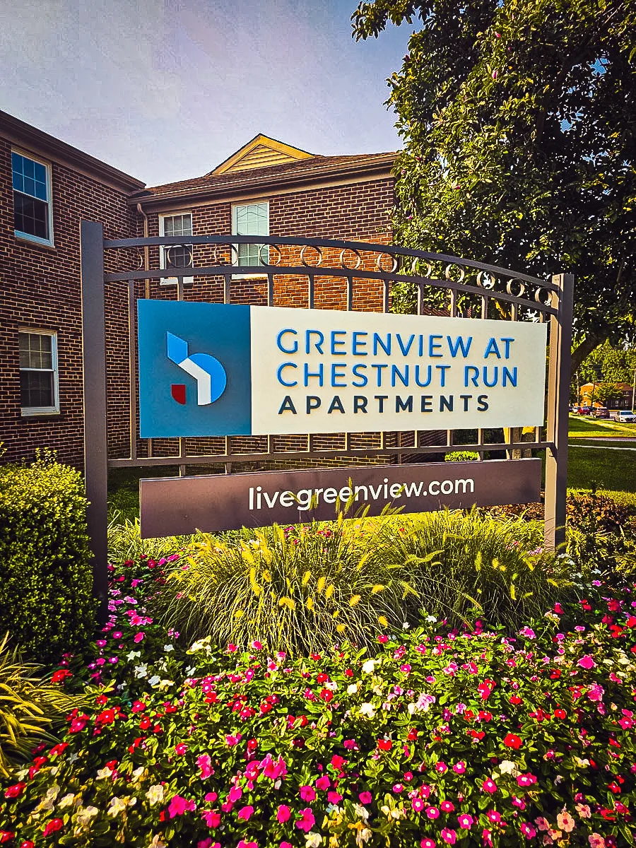 Commercial exterior sign for Greenview at Chestnut Run Apartments with landscaping