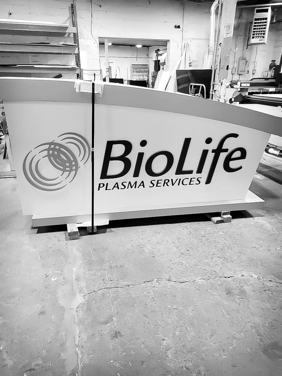 Commercial interior sign for BioLife Plasma Services with exterior signage