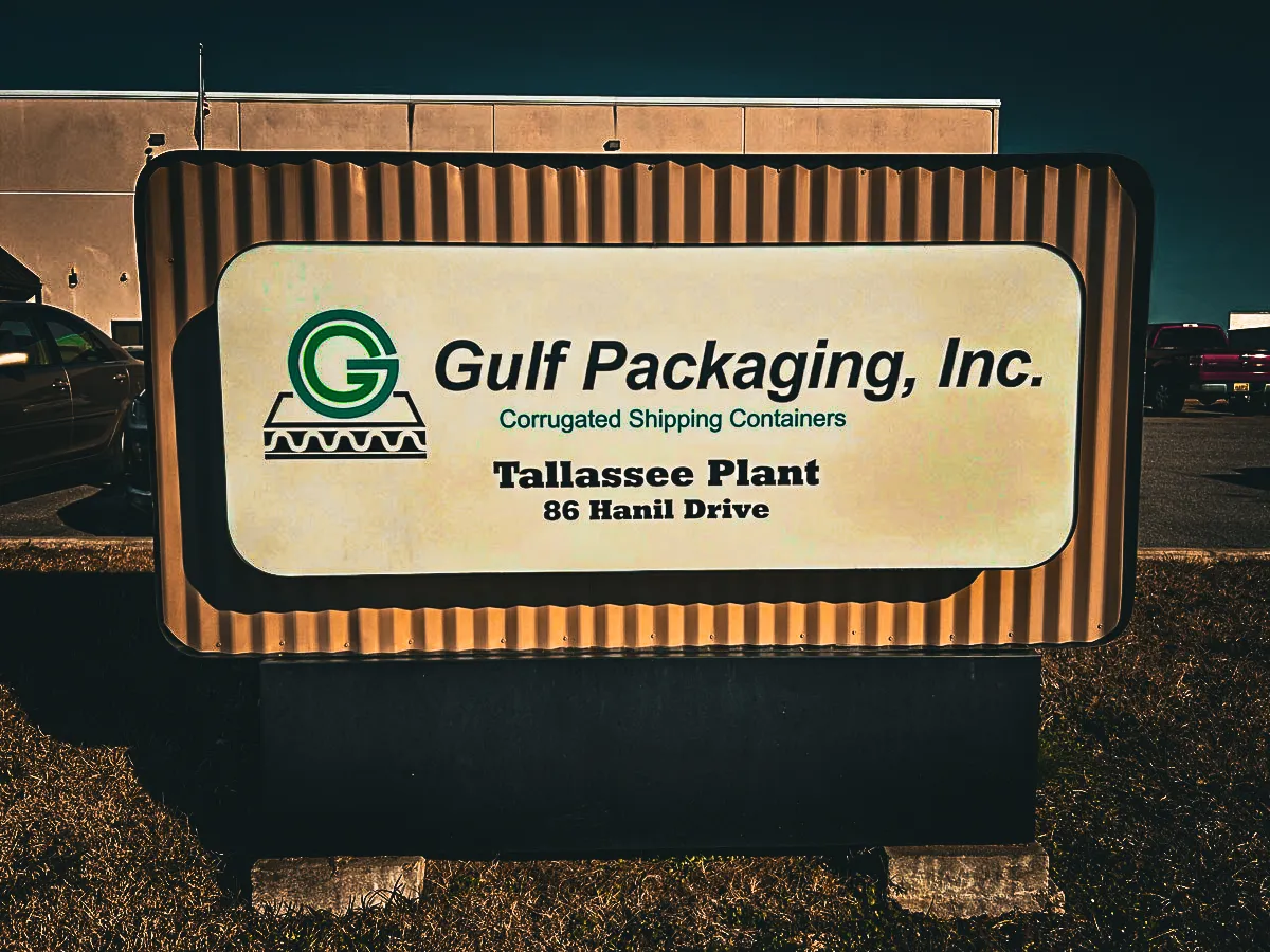 Commercial exterior sign for Gulf Packaging with shades and awnings