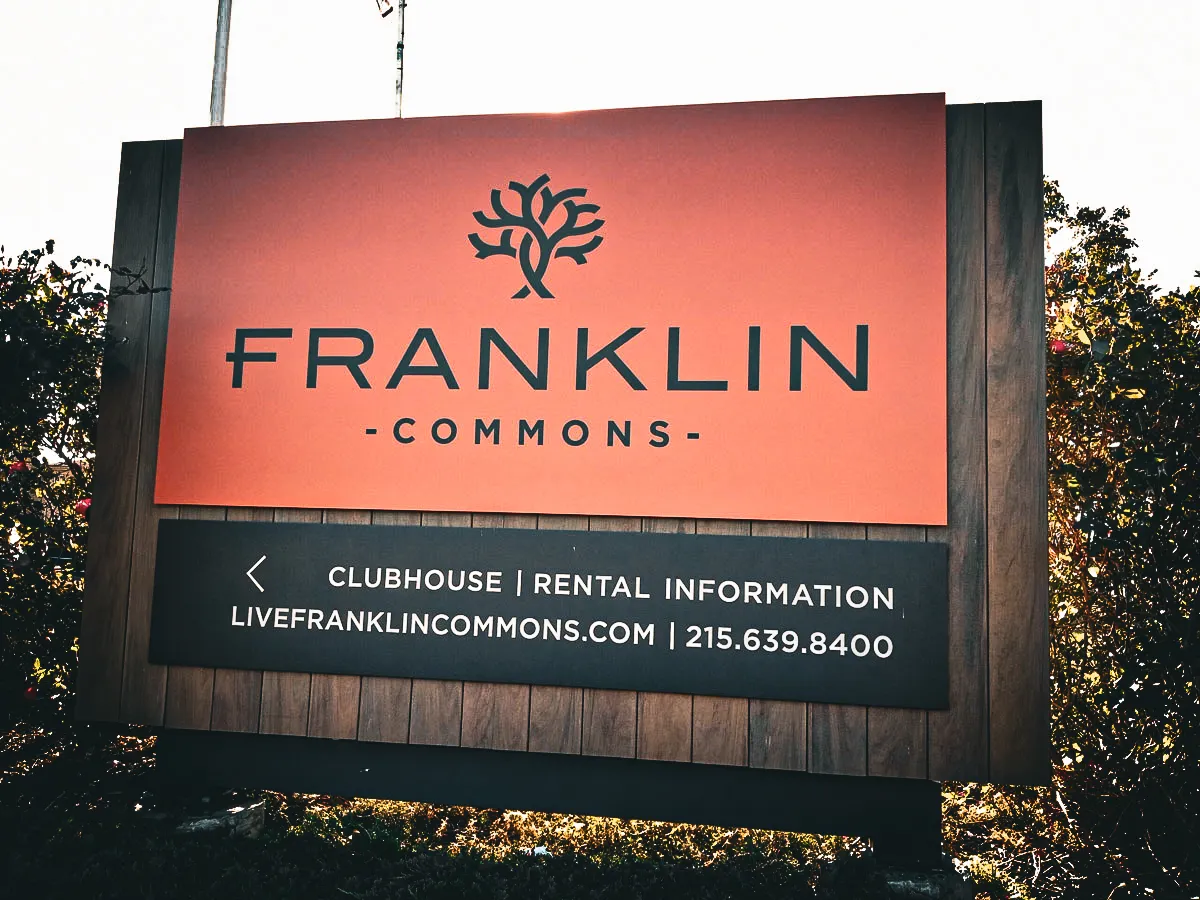 Commercial exterior sign for Franklin Commons with rental information and logo