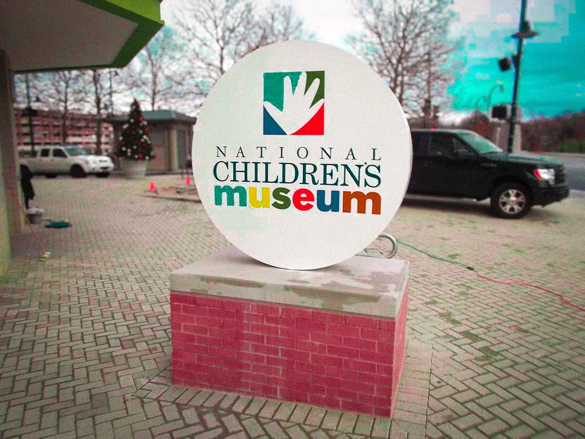 Commercial exterior sign for National Children's Museum with winter landscape