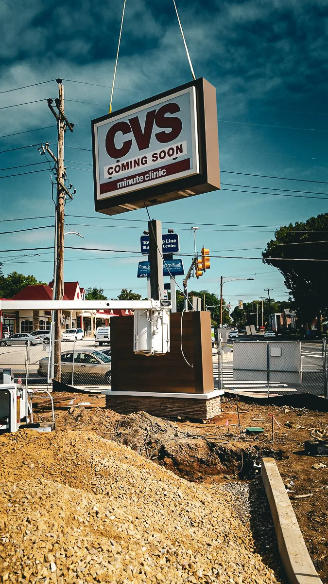Commercial exterior construction site with CVS Minute Clinic sign and awnings