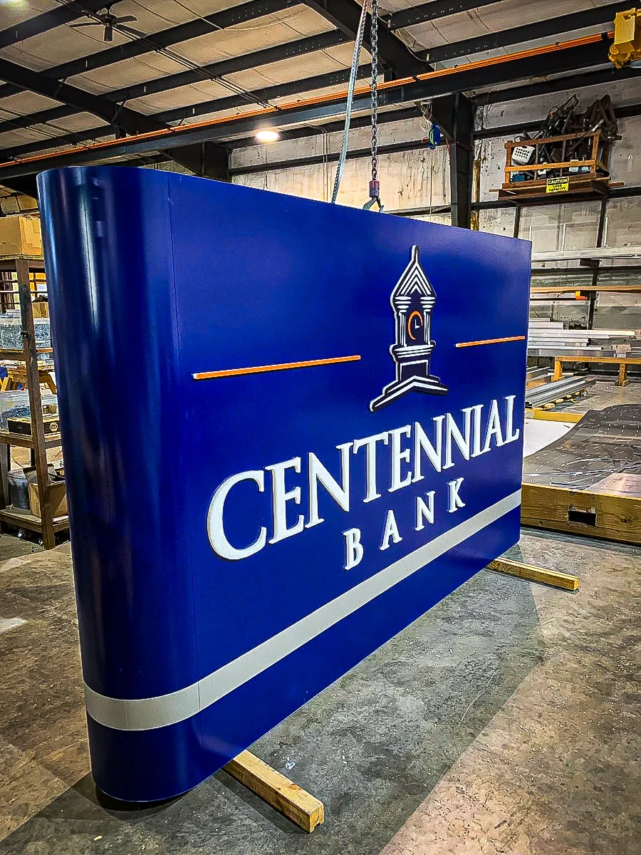 Commercial interior sign for Centennial Bank with exterior awning display