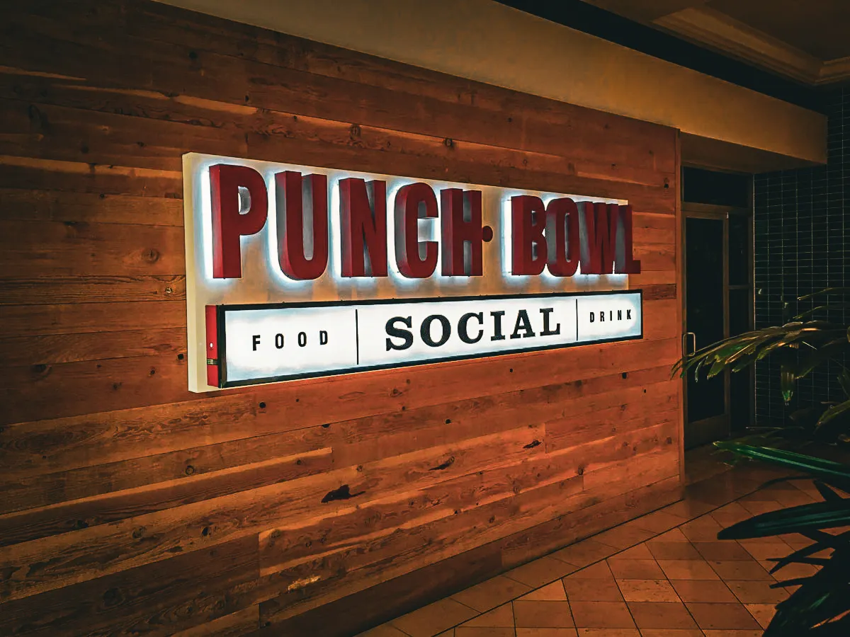 Commercial interior signs for Punch Bowl Social with exterior wood paneling