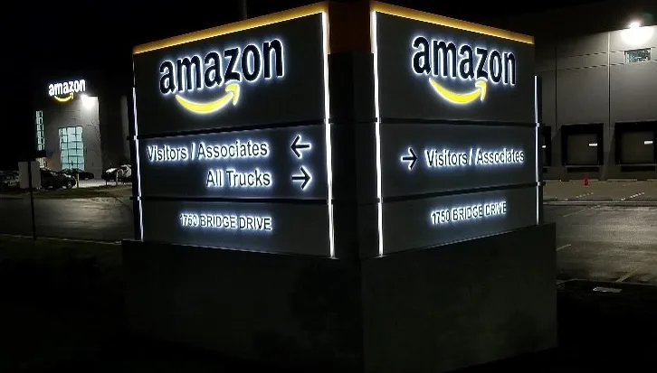 Commercial exterior signs and awnings for Amazon facility at night