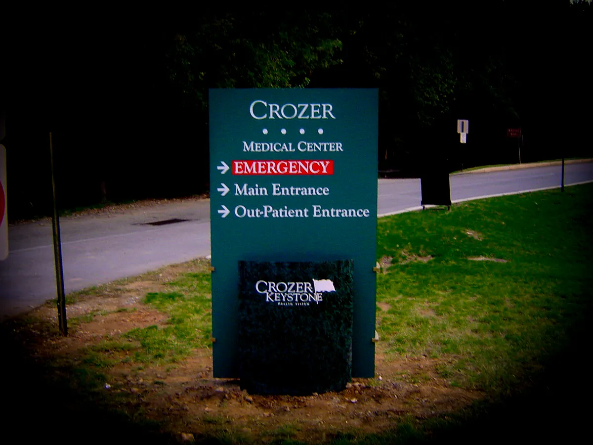 Commercial exterior sign with directions for Crozer Medical Center entrances