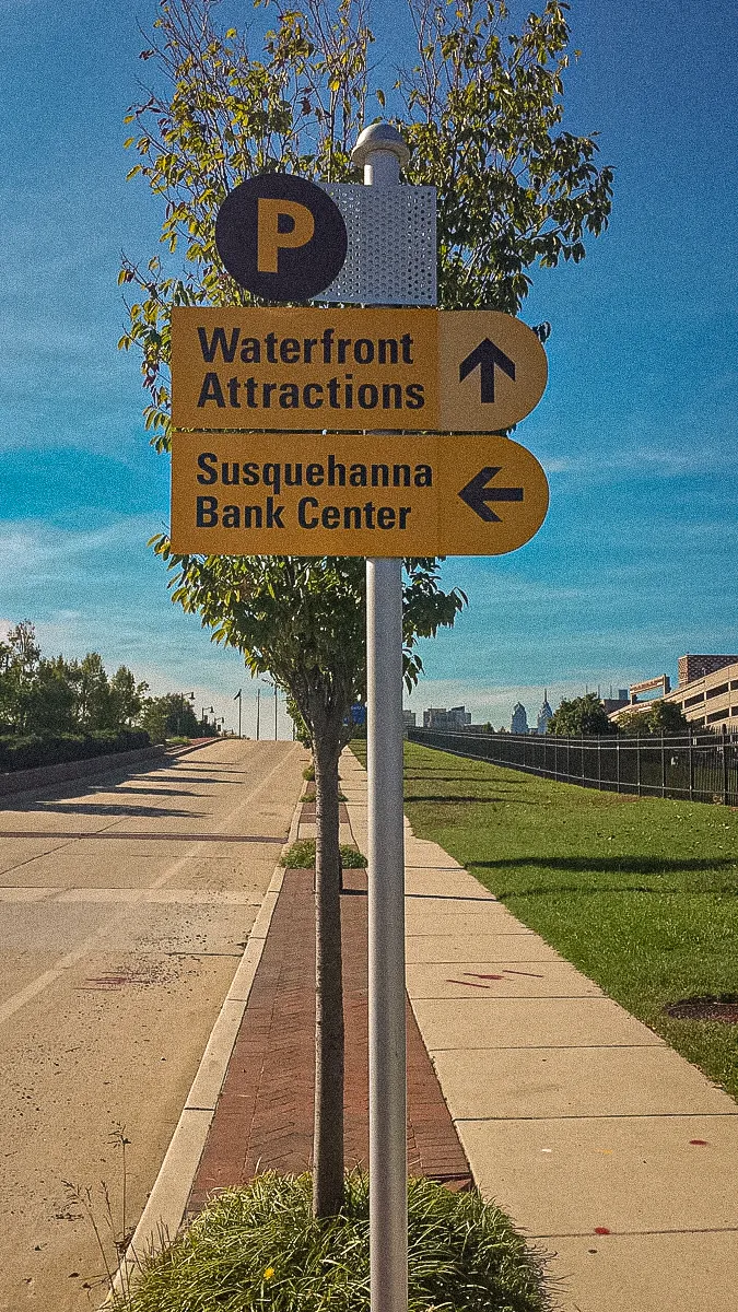 Commercial exterior signs directing to Waterfront Attractions and Susquehanna Bank Center