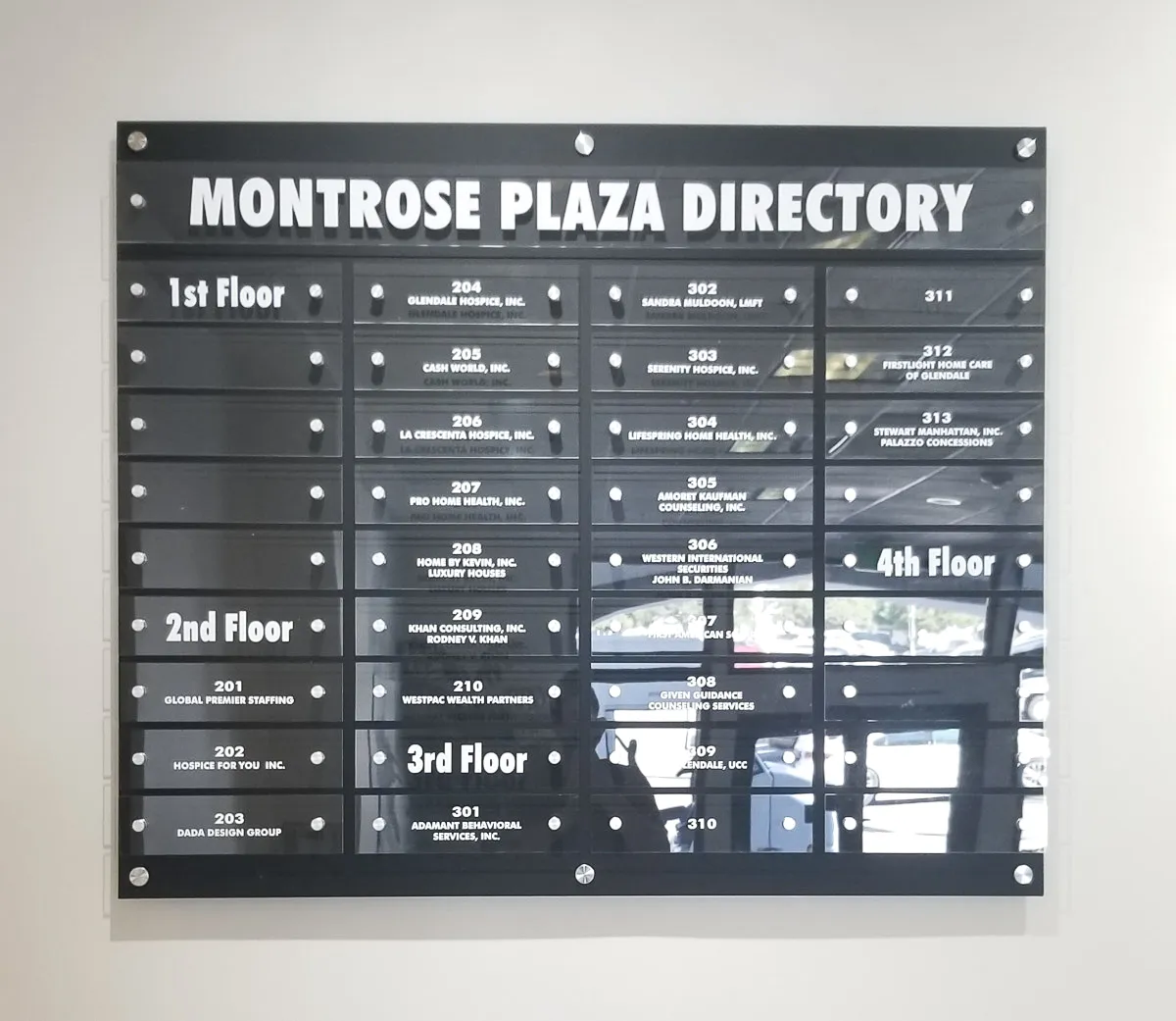Commercial interior directory sign for Montrose Plaza listing business tenants