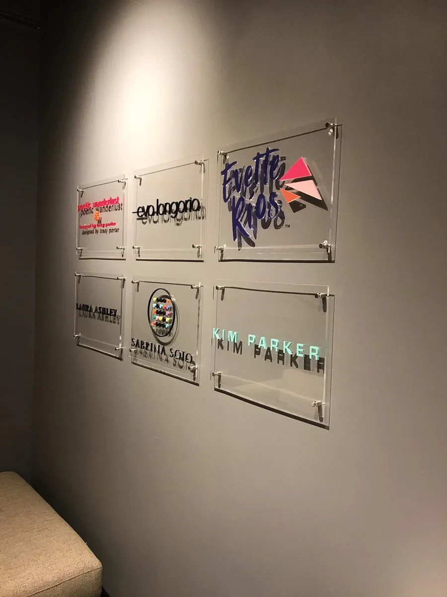 Commercial interior wall with acrylic exterior signs and awnings
