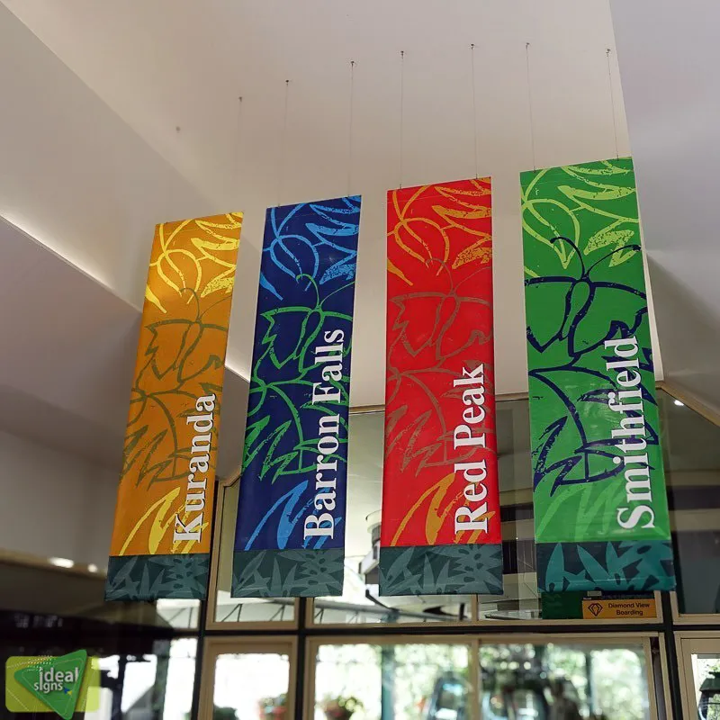 Commercial interior exterior signs with colorful banners for various locations