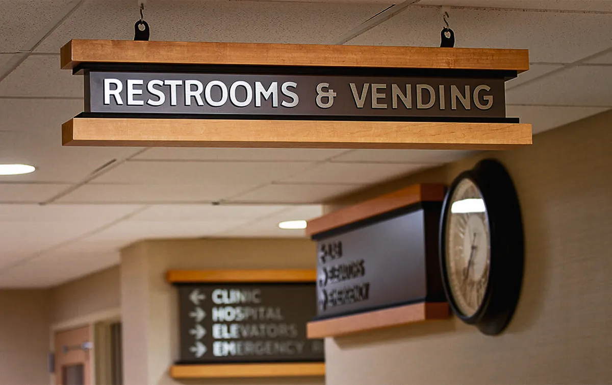 Commercial interior signage for restrooms and vending with exterior wayfinding signs