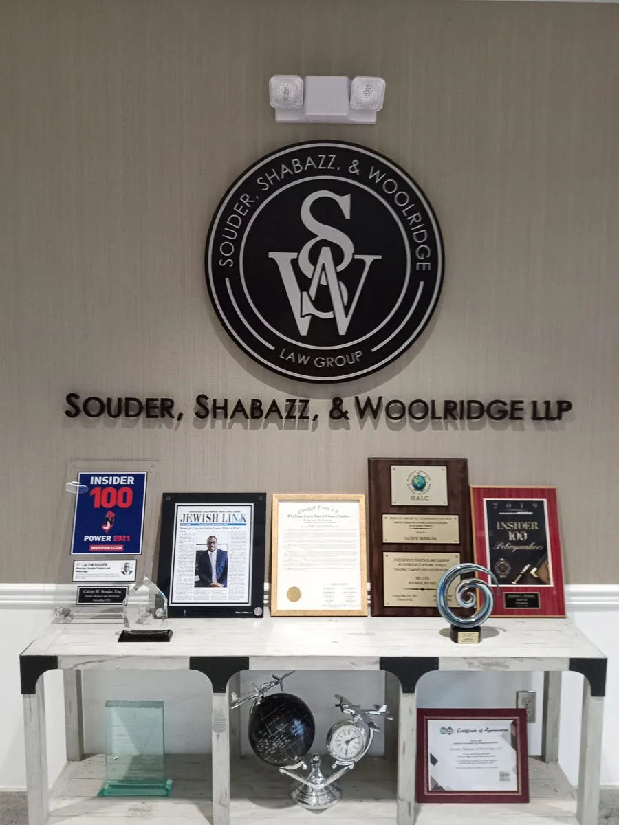 Commercial Interior Signs Showcasing Souder, Shabazz, & Woolridge Law Group Awards