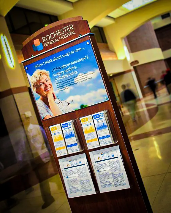 Commercial interior hospital sign with exterior awnings displaying medical information