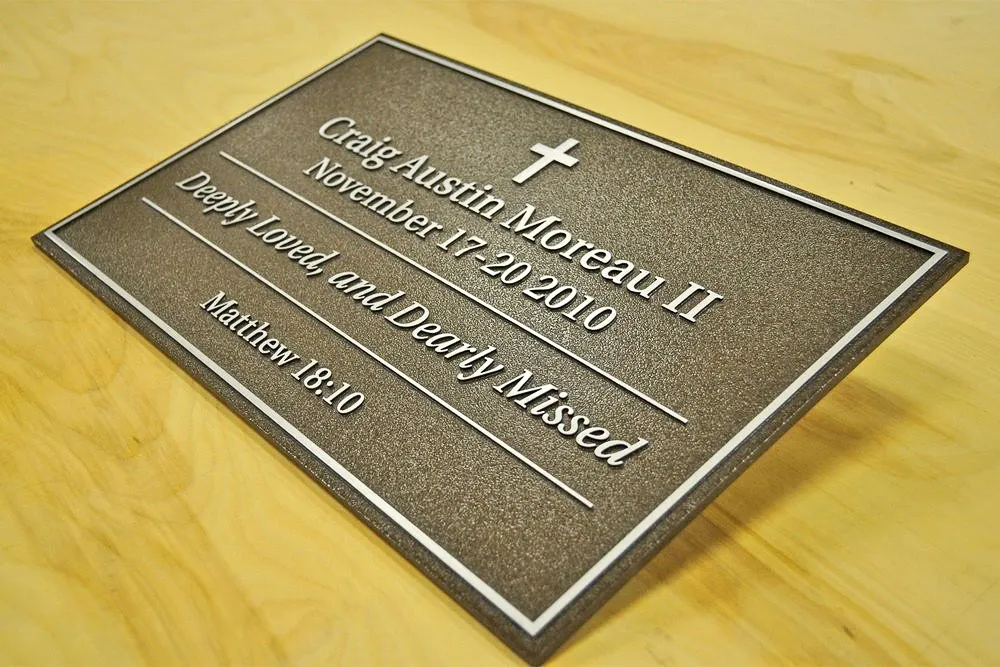 Commercial memorial plaque with exterior signage for Craig Austin Moreau II